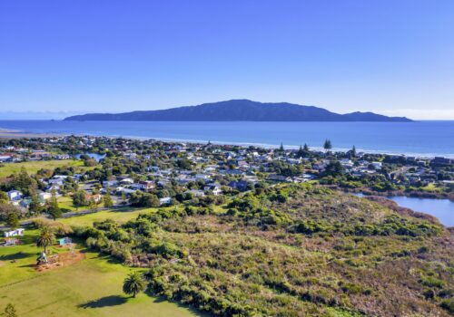 An aerial view of the coast of the ocean at the Kapiti island in New Zealand