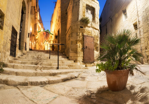 Ancient streets in Vittoriosa, small village on the shores of Grand Valetta Bay in Malta, on a quiet evening.